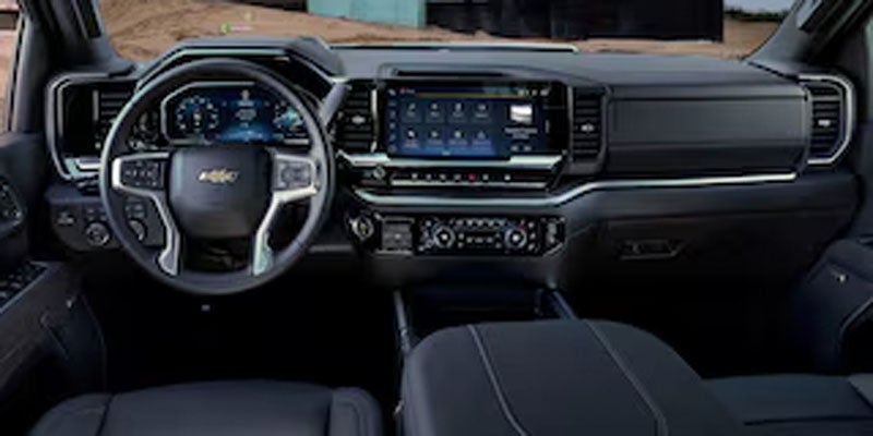 Chevrolet Silverado HD interior featuring a digital driver information display, infotainment touchscreen
